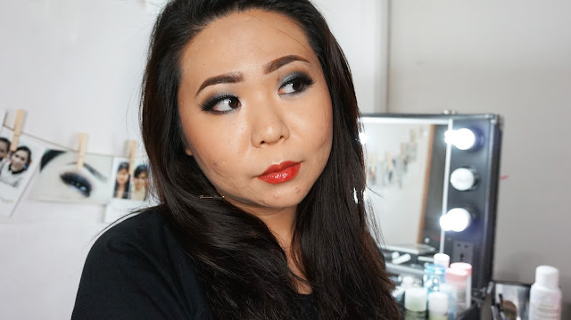 Sultry smokey look with Urban Decay Naked One palette in the color of gunmetal, creepy, buck and virgin. Combined with a red natural lip gloss from Bourjois Rouge Edition Aqua Laque in 04. A good combination for a bridal look for dinner reception. If you are looking for a make up artist in Jakarta, kindly contact me.